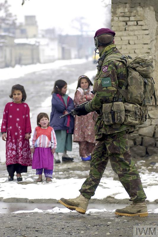 The Wick - BRITISH FORCES IN AFGHANISTAN, OPERATION FINGAL 2002 (LAND-02-012-0865) A paratrooper of Bruneval Company, 2nd Battalion The Parachute Regiment, passes a group of young children during a security patrol in the centre of Kabul Afghanistan, February 2002.

British troops were deployed in Afghanistan on Operation FINGAL under the auspices of the International Security Assistance Force (ISAF). The mission was to assist the interim administration with security and stabilit... Copyright: © IWM. Original Source: http://www.iwm.org.uk/collections/item/object/205217188