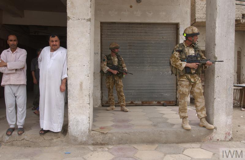 The Wick - OPERATION TELIC:  BRITISH FORCES IN IRAQ, 2003 (OP-TELIC 03-010-37-284) The advance into Basra City.  Watched by Iraqi civilians, soldiers of 3rd Parachute Regiment secure the Old Town. Copyright: © IWM. Original Source: http://www.iwm.org.uk/collections/item/object/205216564