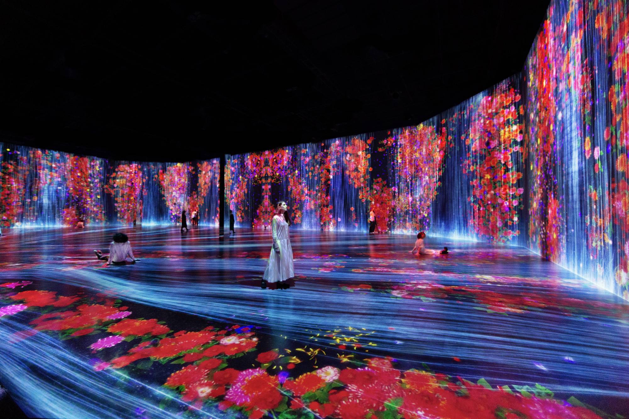 The Wick - teamLab, Flowers and People, Cannot be Controlled but Live Together - Transcending Boundaries, A Whole Year per Hour 2017. Sound: Hideaki Takahashi. Installation view of Every Wall is a Door, Superblue Miami, 2021.   teamLab, Courtesy Pace Gallery
