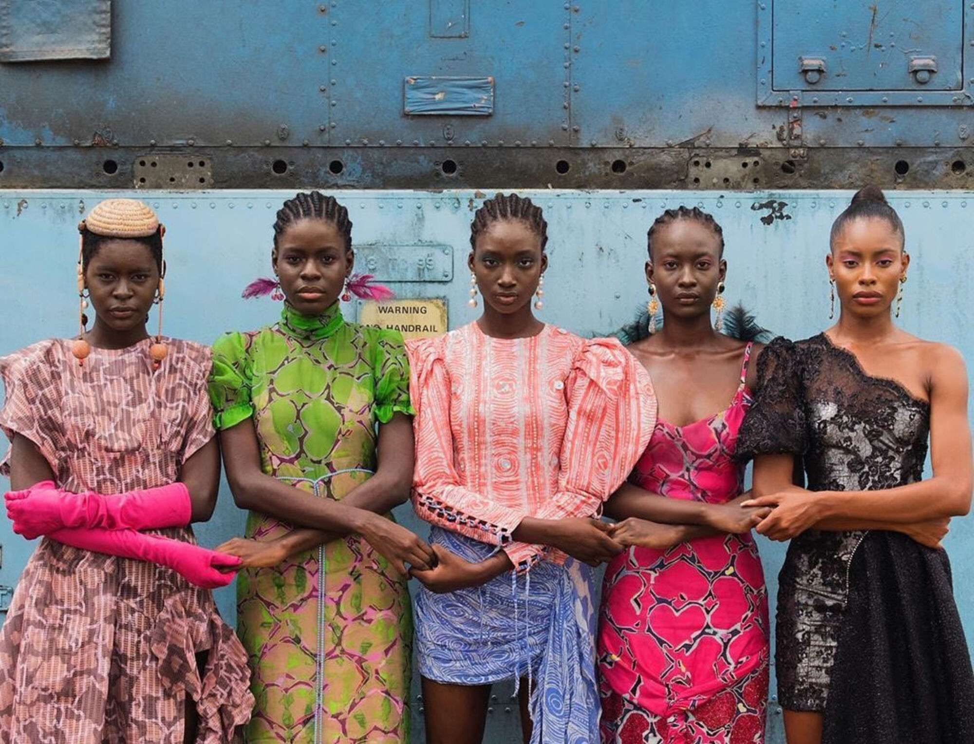 The Wick Culture - Models holding hands, Lagos, Nigeria, 2019 by Stephen Tayo. Courtesy Lagos Fashion Week