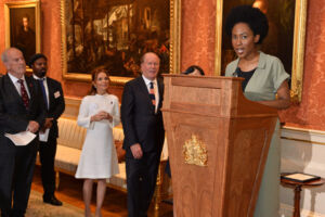 The Wick - Theresa Lola. Announcing winners at The Queens Commonwealth Essay Competition event in Buckingham Palace (2019)