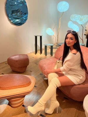 The Wick - 2022-10 PAD Collectors Preview day - image of me in my favourite booth this year, by Galerie Gosserez, I am sitting on design sofa piece by artist Roula Salamoun 
