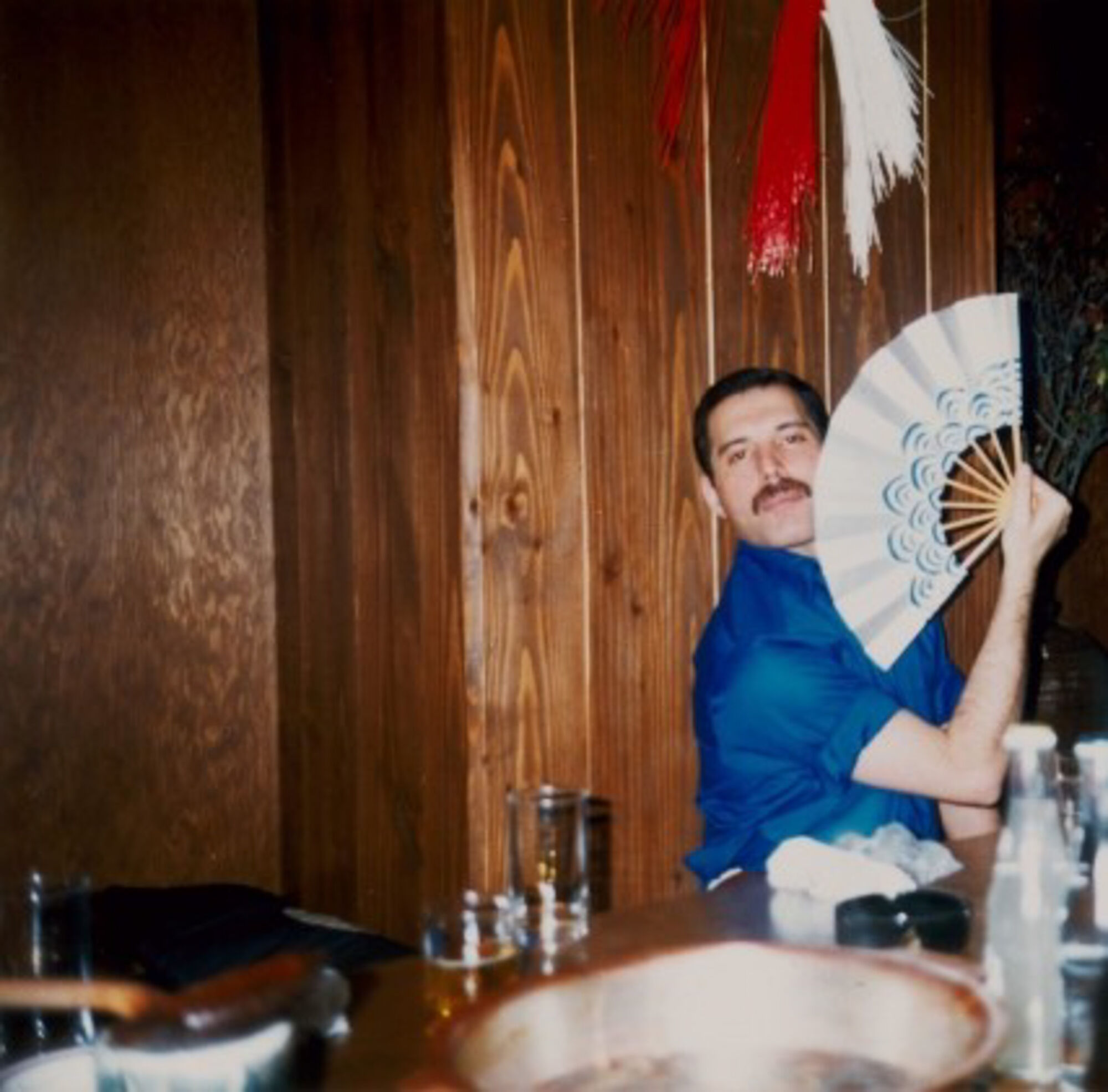 The Wick - A candid photograph of Freddie relaxing after a concert in a Japanese restaurant, courtesy of Sotheby's 
