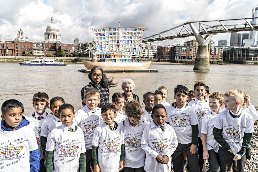 The Wick Culture - Art Action Change today announced the landmark art installation project ‘The Ship of Tolerance’ is coming to London. The iconic artwork by leading conceptual artists Emilia Kabakov (right) is being created at London’s Royal Docks from the 3rd – 31st August 2019, before heading to the River Thames at the Tate Modern, Bankside from 4th September – 7th October 2019.

 
‘The Ship of Tolerance’ was first launched in Siwa Egypt in 2005, to engage children and young adults in an active discussion surrounding tolerance in their daily lives. The seminal art project has since been to New York, La Havana, Zug, Venice, Miami, UAE and Rome with the mission of ‘The Ship of Tolerance’ being to educate and connect the youth of different continents, cultures and identities through the language of art.