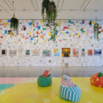 3 bean bags in front of colourful wall with multiple artworks at Hauser & Wirth by Hospital Rooms