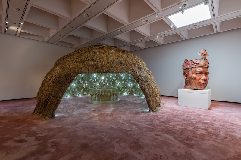 The Wick Culture - Installation view of Tavares Strachan: There Is Light Somewhere. Henrietta, 2014, and Seated Panchen Lama, 2011. Photo: Mark Blower. Courtesy the artist and the Hayward Gallery.