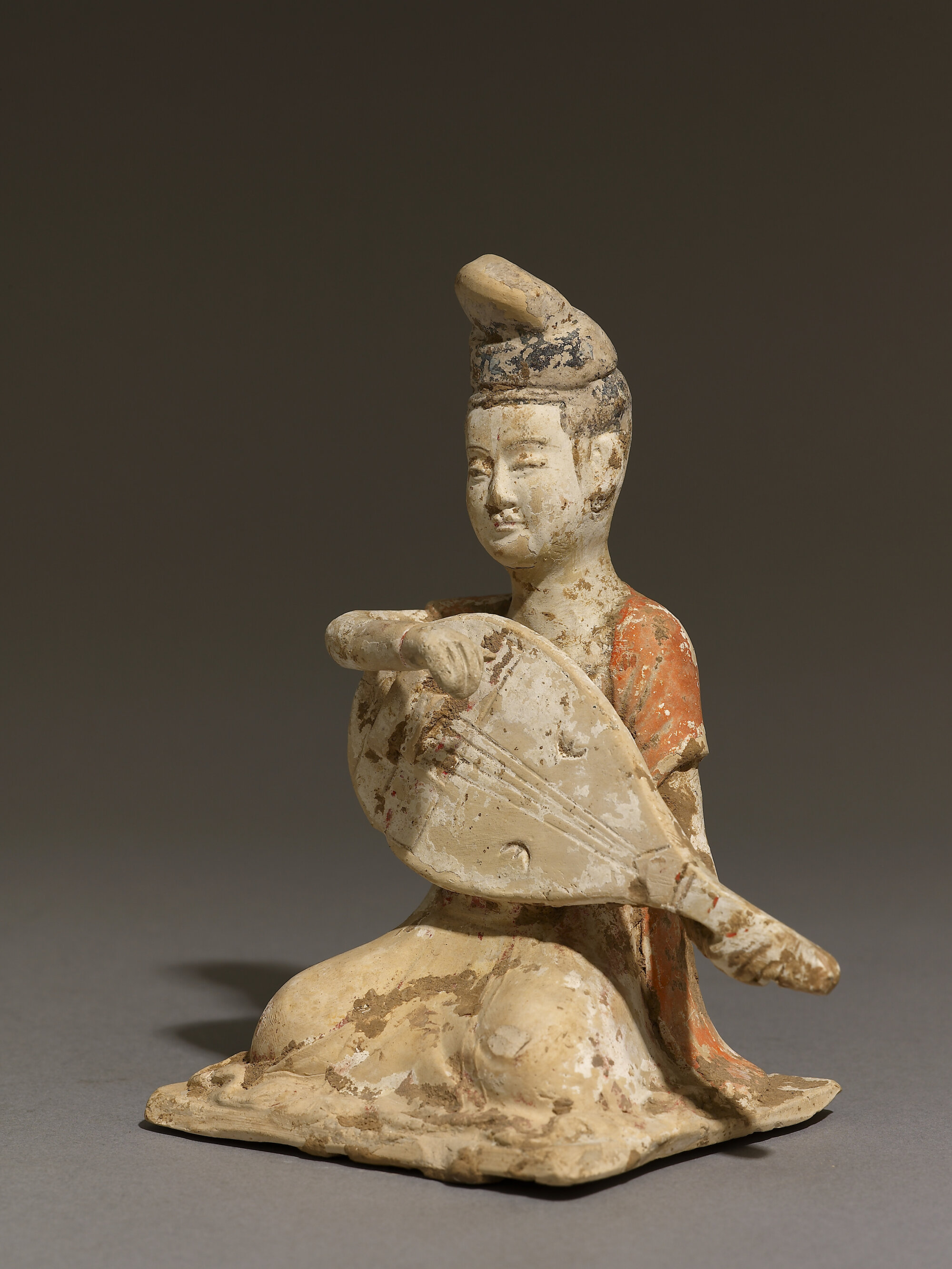 The Wick Culture - Ceramic figure of a lute player © Ashmolean Museum, University of Oxford