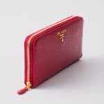 Bright red Prada wallet with gold zip