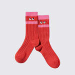 Red and pink socks by Uniqlo and Anya Hindmarch with pink stripes and eyes.