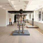 A large room with sculptures