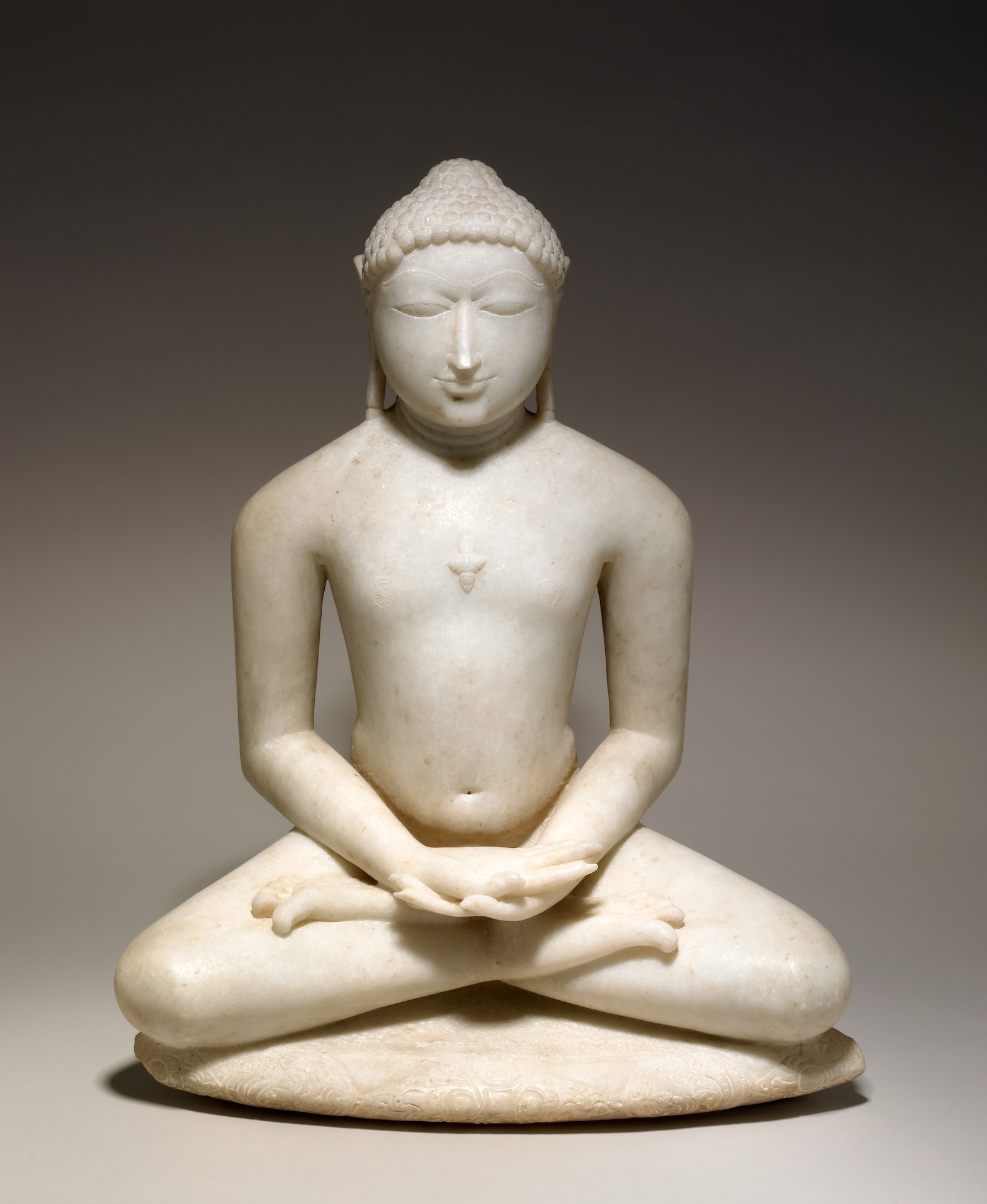 The Wick Culture - Seated Jain enlightened teacher meditating, about 1150-1200 © The Trustees of the British Museum