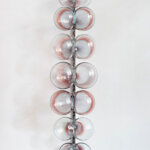 A row of glass balls with red