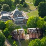 Birds eye view of two buildings in a park