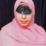 A woman wearing a pink scarf and a cut out eye