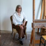 An old woman sitting in a chair
