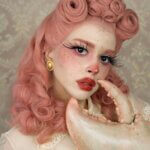 A woman wearing a pink wig