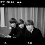 Black and white photograph of three men