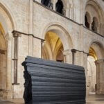 A black large sculpture in a church