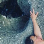 A woman holding a rock