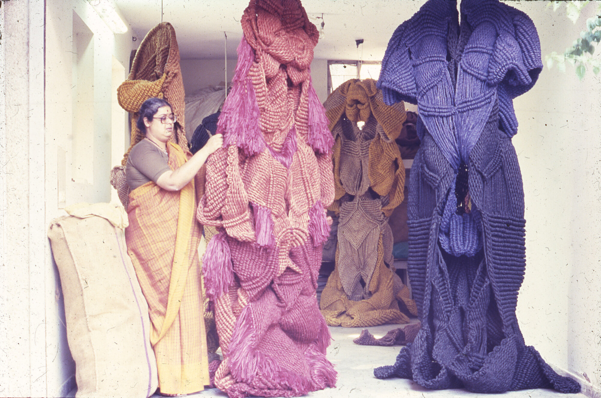 The Wick Culture - Mrinalini Mukherjee and works in progress at her garage studio. New Friends Colony, New Delhi, c.1985. Courtesy of Mrinalini Mukherjee Foundation and Asia Art Archive. Photo: Ranjit Singh