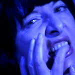 A blue photograph of a woman