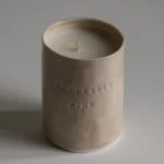 A pink candle that says 'Fearlessly Pink'