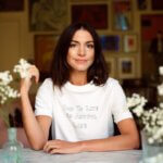 A woman wearing a white t shirt