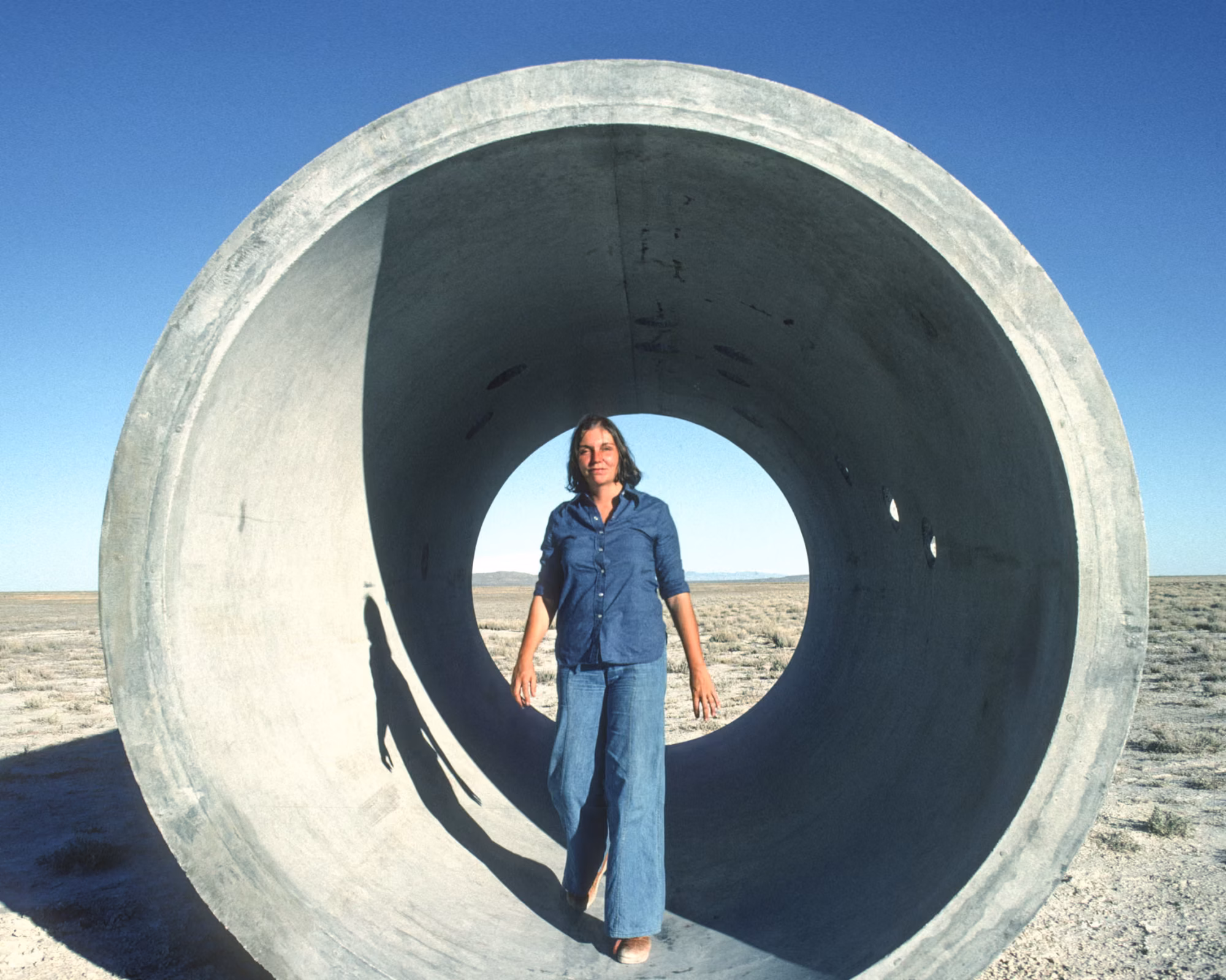 The Wick Culture - Nancy Holt standing inside Sun Tunnels in Utah's Great Basin Desert, 1976. Photograph: Ardele Lister. Artwork © Holt/Smithson Foundation and Dia Art Foundation / Licensed by Artists Rights Society, New York. 